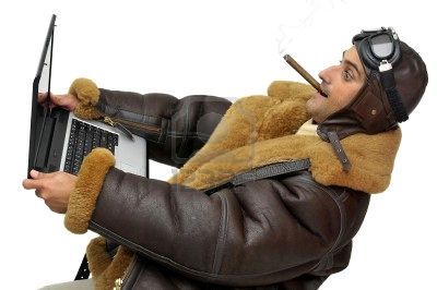 6493896784697fighterpilotwithlaptopisolatedinwhite.jpg